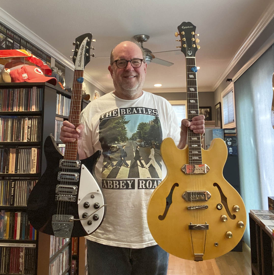 person holding guitars