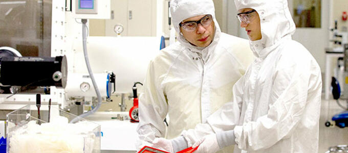 students working in a clean lab