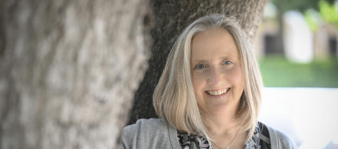 Laura Wuethrich standing in front of a tree